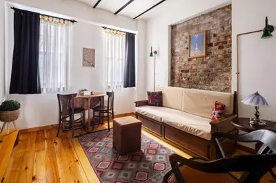a living room with a couch and a table at Charming 2BD2Bath Galata Tower Unique Home! #409 in Istanbul