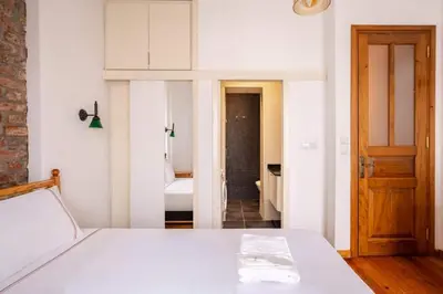 a bedroom with a white bed in a room at Charming 2BD2Bath Galata Tower Unique Home! #409 in Istanbul