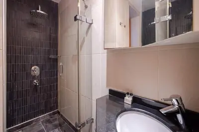 a bathroom with a sink and a shower at Cool Authentic 2BD2Bath Galata Tower Home! #413 in Istanbul