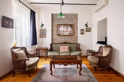 a living room with a couch and chairs at Cozy Intimate 2BD2Bath Galata Tower Home! #410 in Istanbul