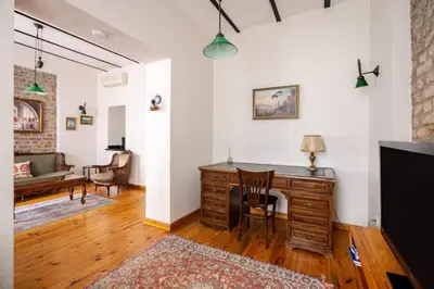 a living room with a desk and a couch at Cozy Intimate 2BD2Bath Galata Tower Home! #410 in Istanbul