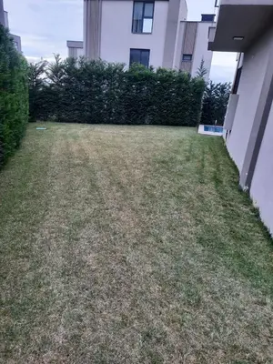 an empty yard in front of a building at Villa with private pool for daily rent in Istanbul in Buyukcekmece