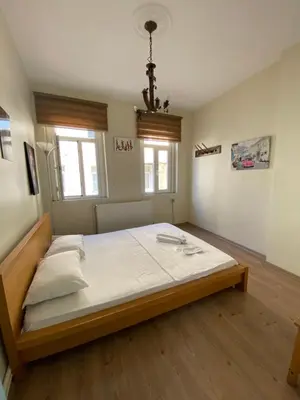 a bedroom with a large bed in a room at Taxim Sofa Suites in Istanbul