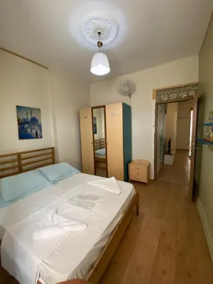 a bedroom with a large white bed in it at Taxim Sofa Suites in Istanbul