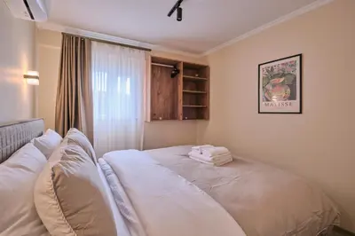 a bedroom with a bed with towels on it at House Kadıköy in Istanbul