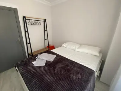 a small room with a bed with a towel on it at ŞAH apartmanı in Istanbul