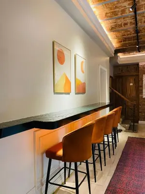 a bar in a room with a row of chairs at Vion Hotel Taksim in Istanbul