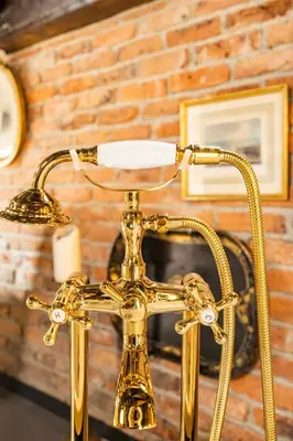 a close up of a gold lamp on a table at NOLD Suite in Istanbul