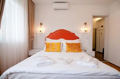 a bedroom with a bed with two towels on it at Blue Mosq Pansiyon & Apart in Istanbul