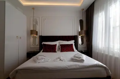 a bedroom with a bed with two towels on it at Blue Mosq Pansiyon & Apart in Istanbul