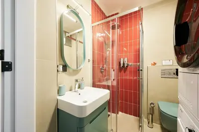 a bathroom with a sink and a shower at Cihangir Pop Art Hideaway in Istanbul