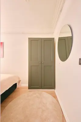 a bedroom with a bed and a mirror at Cihangir Pop Art Hideaway in Istanbul