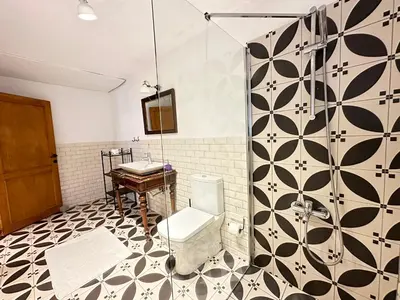 a bathroom with a toilet and a sink at Nefes Ada Taş Bina - Bahçe Katı in Istanbul