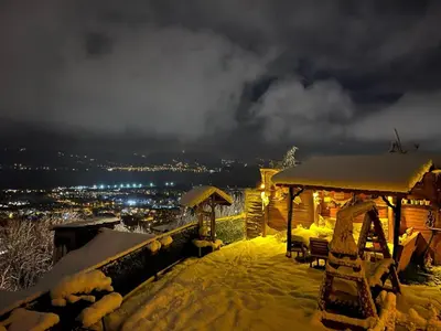 a gazebo with snow on top of it with a city at Sapanca Turuncu Hobbit Evi in Sapanca