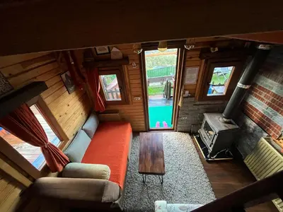 an overhead view of a living room with a couch and a stove at Sapanca Turuncu Hobbit Evi in Sapanca