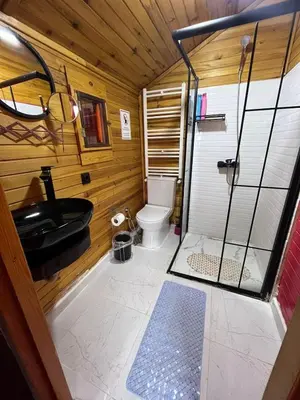 a bathroom with a toilet and a sink at Sapanca Kırmızı Hobbit Evi in Sapanca