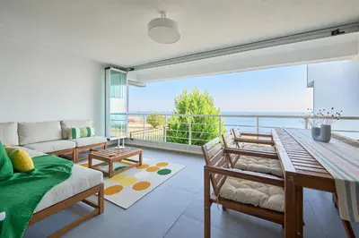 a living room with a table and a large window at Stunning Sea View, Peaceful Family Villa with AC, Sauna, Gym & Shared Pool in Silivri