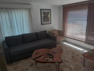 a living room with a couch and a table at Art & Natura in Marmara