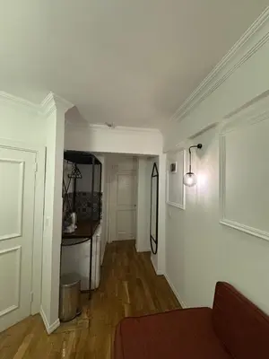 a living room with a hallway with a table and a room with at Veva flats hotel in Istanbul