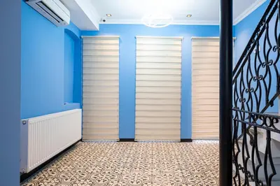 a walk in closet with blue walls and a staircase at Galata heart suits in Istanbul