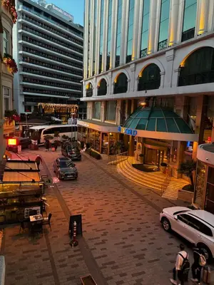a city street with cars parked in front of buildings at Taksim Green Flat Apartment 2 in Istanbul