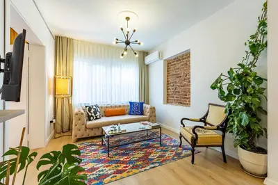 a living room with a couch and a table at 2BR Historical apartment 5 min to Taksim Sq in Istanbul