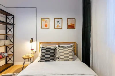 a bedroom with a bed with pillows on it at 2BR Historical apartment 5 min to Taksim Sq in Istanbul
