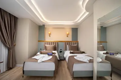 a row of beds in a room with curtains at Hotel De Bonte in Istanbul