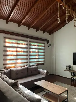 a living room with a couch and a coffee table at Selbeshome in Sapanca