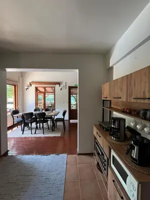 a kitchen and dining room with a table and chairs at Selbeshome in Sapanca