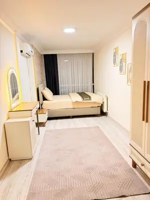 a bedroom with two beds and a rug at Luxury Apartment In A Great Location 10 in Istanbul