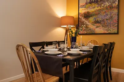 a dining room table with a black table cloth and chairs at Renovated Flat near Tram All Rooms AC in Istanbul