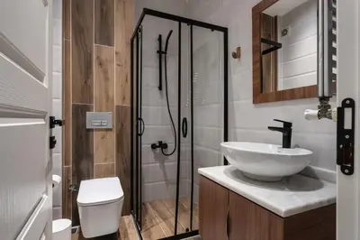 a bathroom with a sink and a shower at Renovated Flat near Tram All Rooms AC in Istanbul