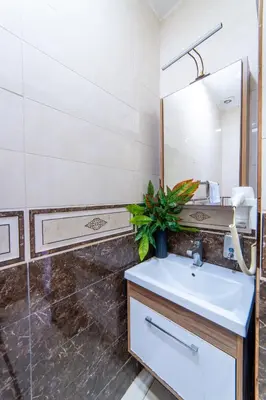 a bathroom with a sink and a mirror at Boutique Sultan Hotel & Restauran in Istanbul