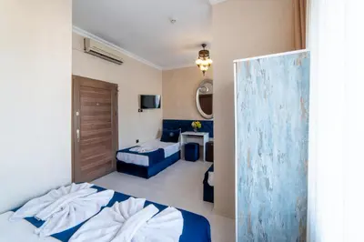 a hotel room with a bed and a bathroom at Boutique Sultan Hotel & Restauran in Istanbul