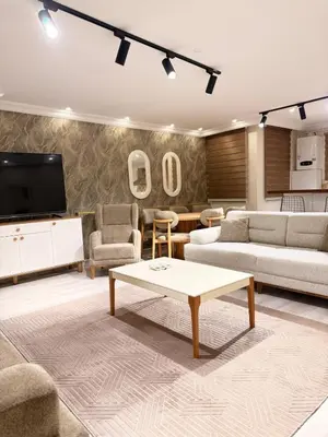 a living room with a couch and a coffee table at Great Location Terrace Apartment 15 in Istanbul