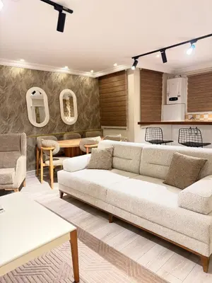 a living room with two couches and a kitchen at Great Location Terrace Apartment 15 in Istanbul