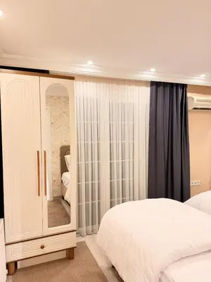 a bedroom with a bed and a dresser with a mirror at Great Location Terrace Apartment 15 in Istanbul