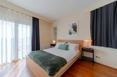 a bedroom with a bed and a large window at Spacious 1-Bedroom Apartment with Bosphorus View in Istanbul