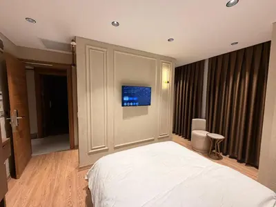 a bedroom with a bed and a tv on the wall at city istiklal in Istanbul