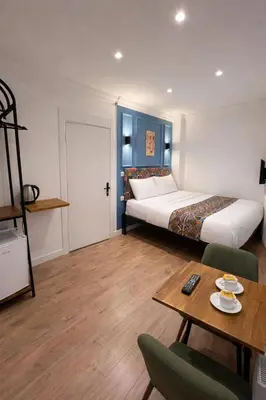 a hotel room with a bed and a table with a coffee table at taksimrosboutique in Istanbul