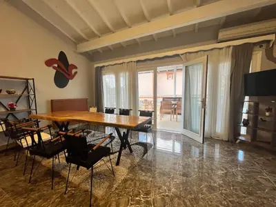 a dining room with a wooden table and chairs at Mansion with private pool in Sapanca in Sapanca