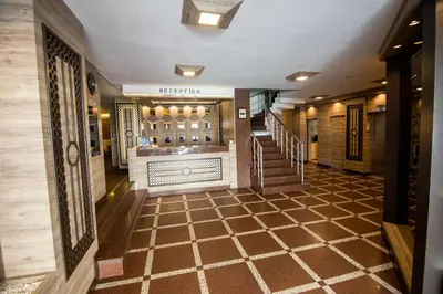 a hallway with a staircase in a building at Sahinler Hotel in Istanbul