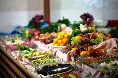 a buffet filled with different types of fruits and vegetables at Sahinler Hotel in Istanbul