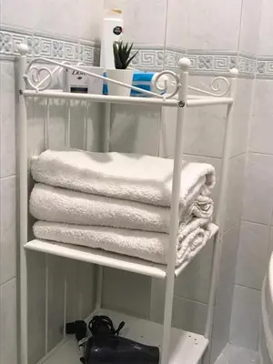 a towel rack with towels on it in a bathroom at Apartment on Pier Loti street with a nice view in Istanbul
