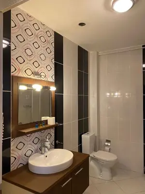 a bathroom with a sink and a toilet at Legend Tem Hotel in Silivri