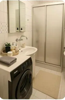 a bathroom with a washing machine and a sink at Romantic Private Room, Beşiktaş-İstanbul in Istanbul