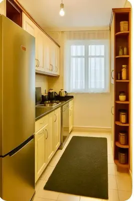 a kitchen with a stainless steel refrigerator and a window at Romantic Private Room, Beşiktaş-İstanbul in Istanbul