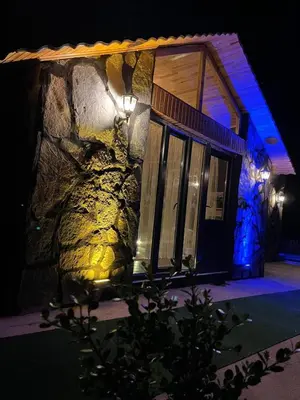 a stone building with a light on it at night at Sakaryabungalow in Geyve