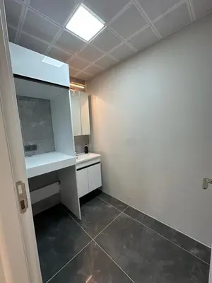 an empty room with a desk and a counter at Villa life in Gümüşyaka